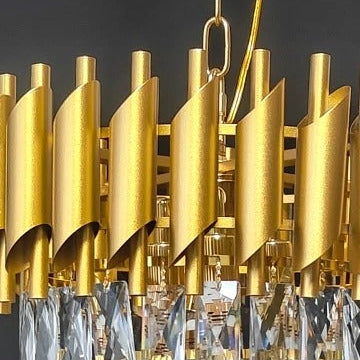 Close-up of gold chandelier drum shades with clear crystal fringe