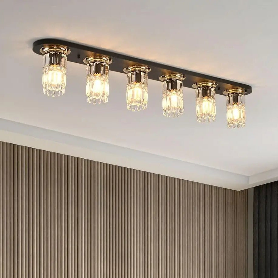 Rectangular flush mount ceiling light with 6 clear glass bulbs on dark metal plate