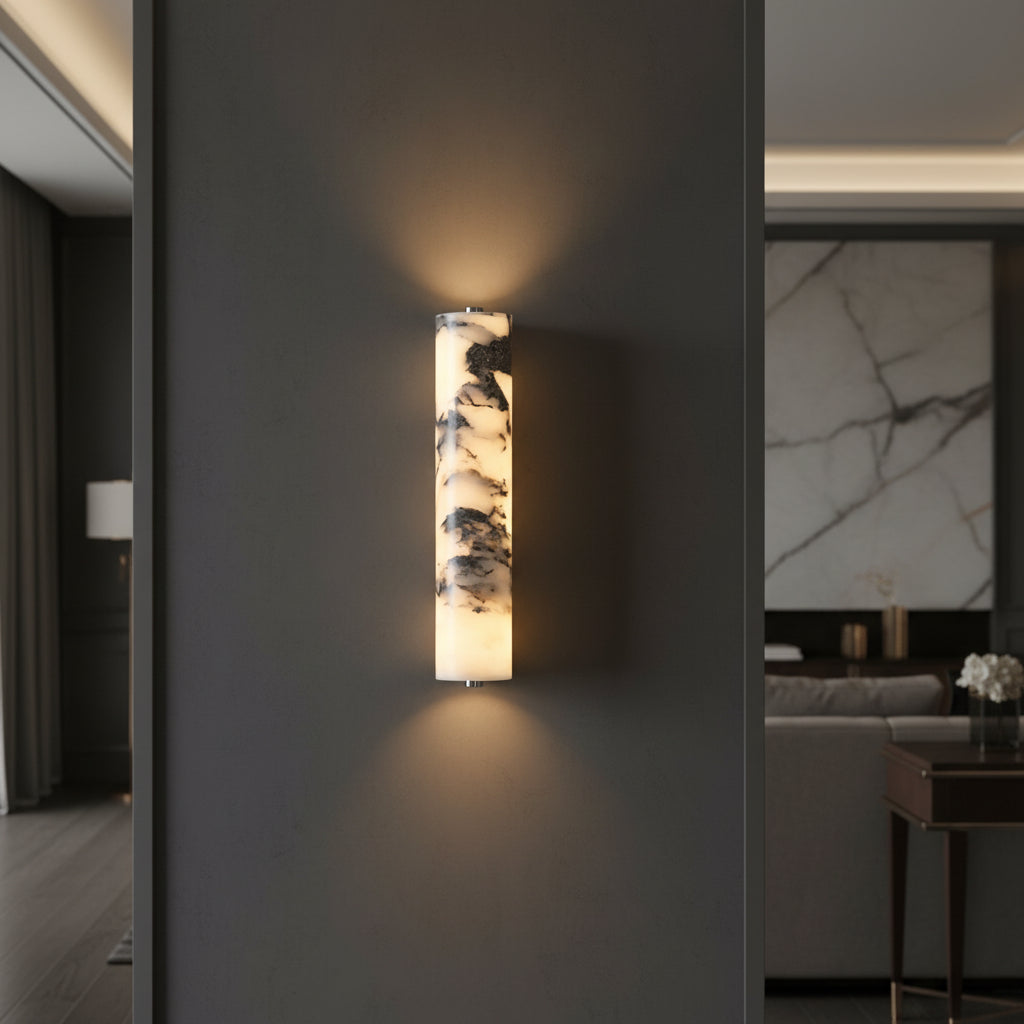 Cylindrical marble wall light with dark mounting bracket and vertical glow diffuser