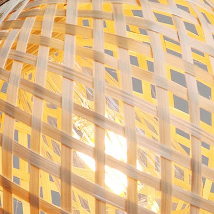 Rattan lattice globe shade close-up with warm light shining through weave