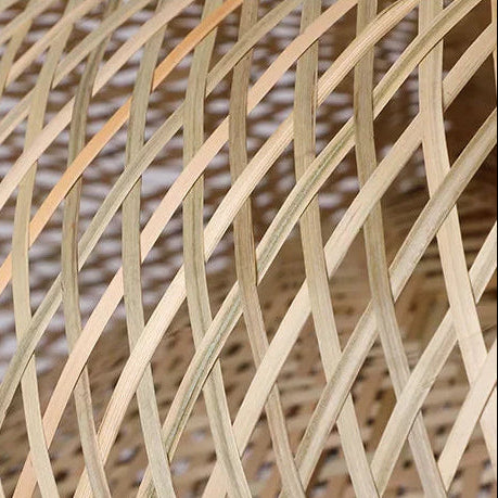 Woven rattan lattice globe shade close-up with intersecting beams