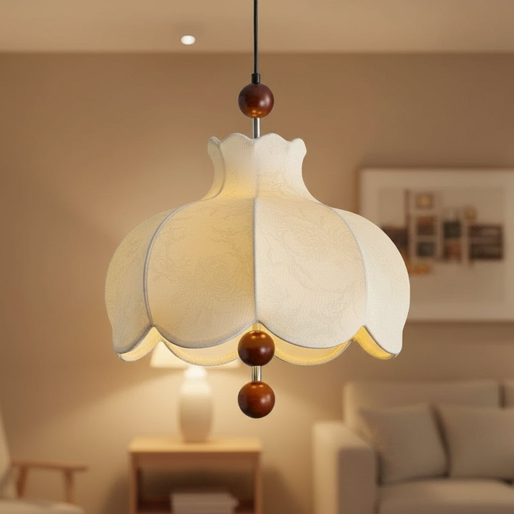Cream scalloped pendant light with warm glow and brown wooden ball pull-down accents