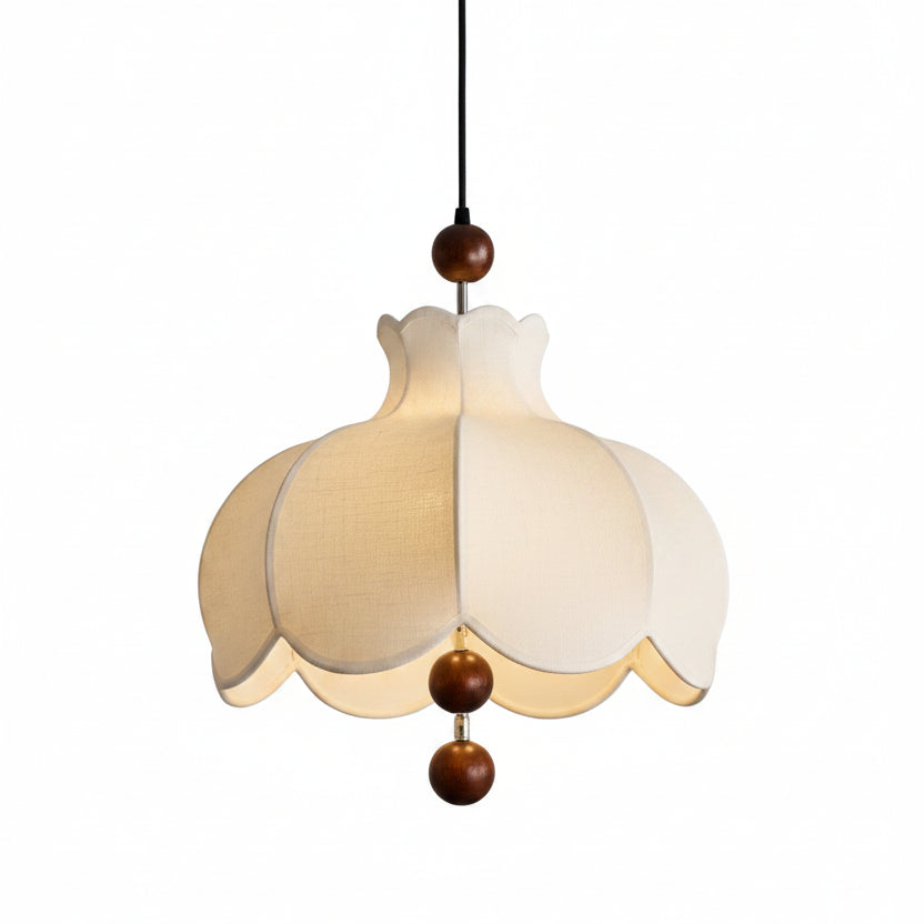 Scalloped cream fabric pendant lamp with brown bead details and black hanging cord
