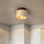 Flush mount ceiling light with travertine drum shade and dark wood top ring
