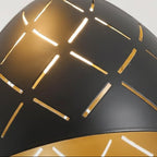 Close-up of black conical shade with gold linear cutouts on spiral chandelier