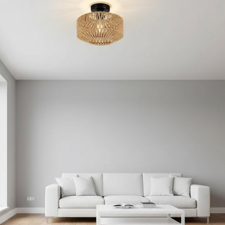 Round woven rattan ceiling drum light with black mounting canopy