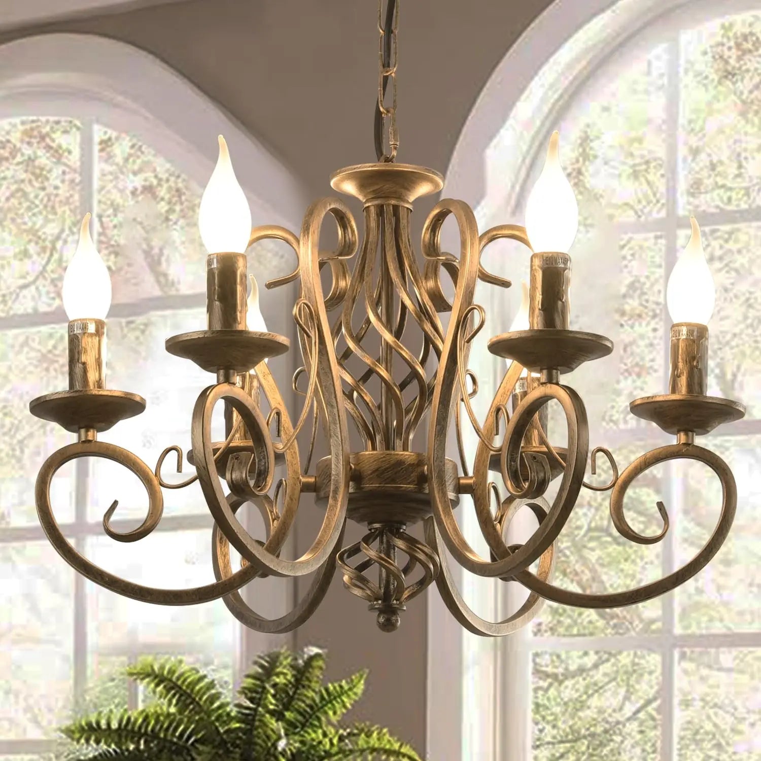 Antique gold scroll-arm cage chandelier with curved lattice and multiple candle cups