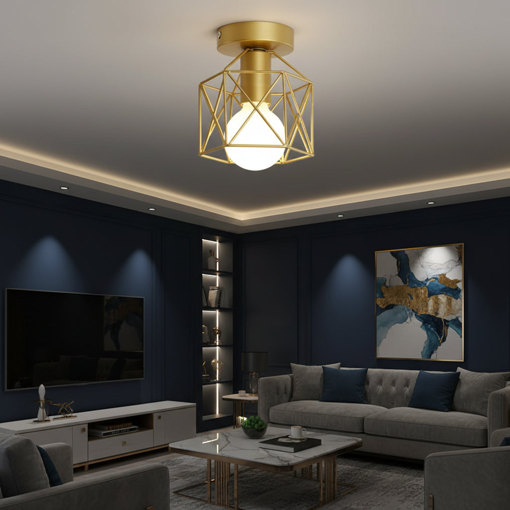 Gold geometric cage flush-mount ceiling light with lit bulb above modern living room