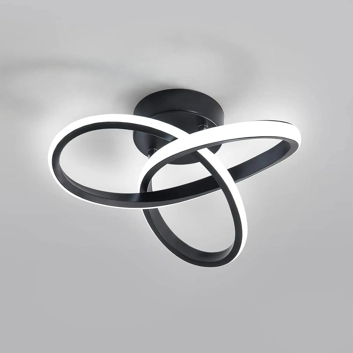 Black interlocking loop ceiling light with curved ring strips, flush mount fixture