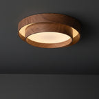 Round dual-ring LED flush mount ceiling light with walnut wood finish and glowing inner diffuser