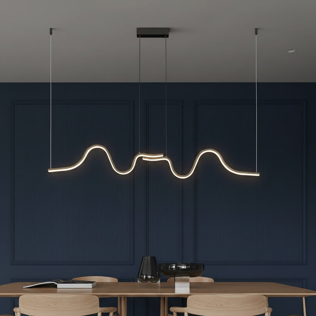 Minimalist wavy linear LED pendant light with dark ceiling canopy and warm glow