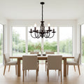 Rustic scroll arms chandelier with five candle-style lights, dark bronze black finish