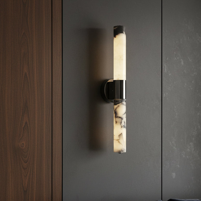 Cylindrical alabaster tube wall sconce with chrome-and-black circular mounting bracket