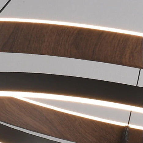Close-up of wood ring LED chandelier with warm linear glow and black metal trim