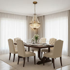 Crystal basket chandelier hanging over dining room table with beaded glass shade