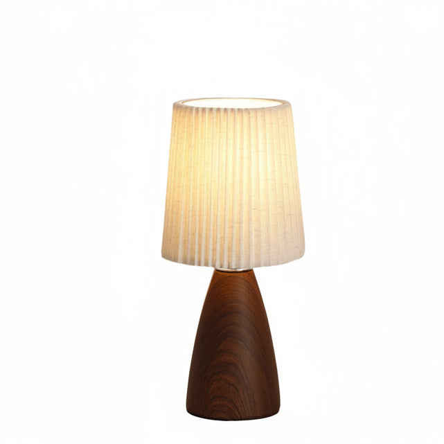 Minimalist ceramic table lamp with pleated beige conical shade and dark wood base