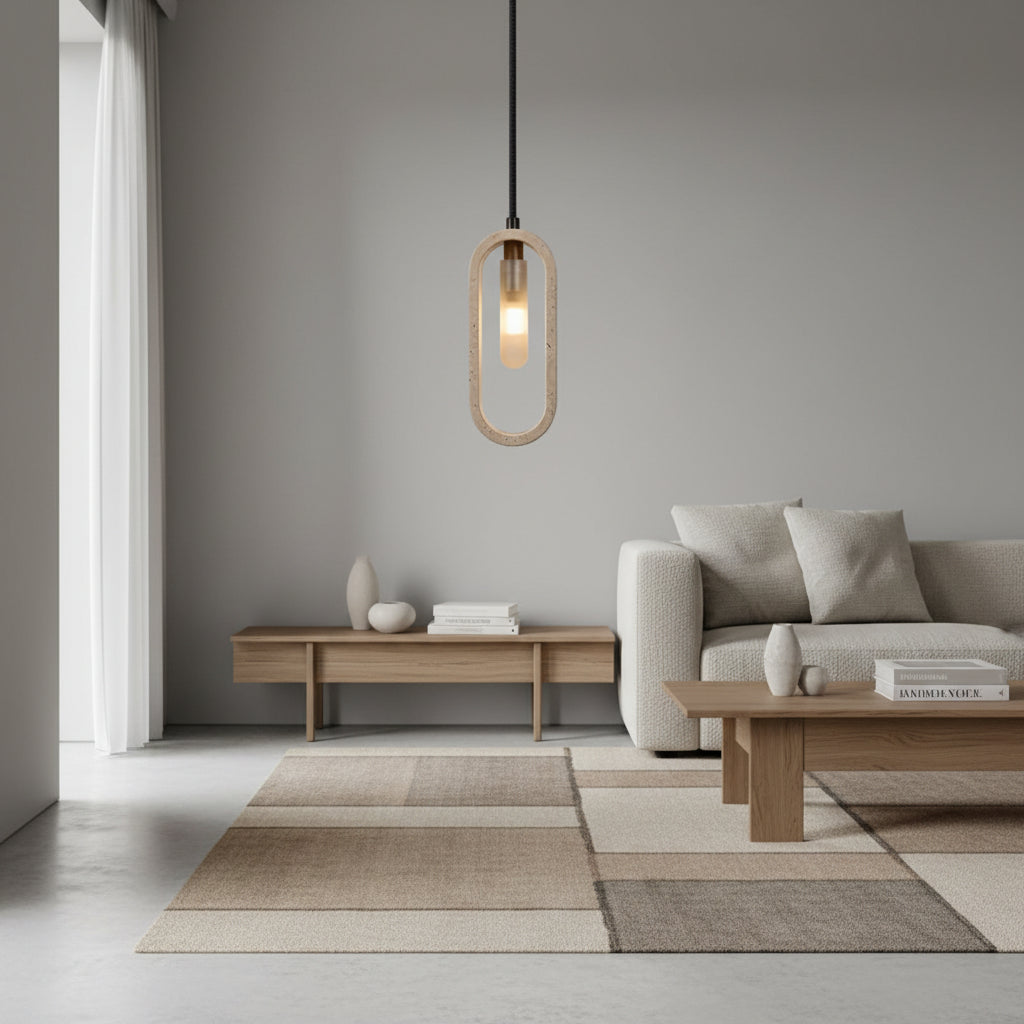 Oval travertine pendant light with warm glowing bulb, hanging from a black cord