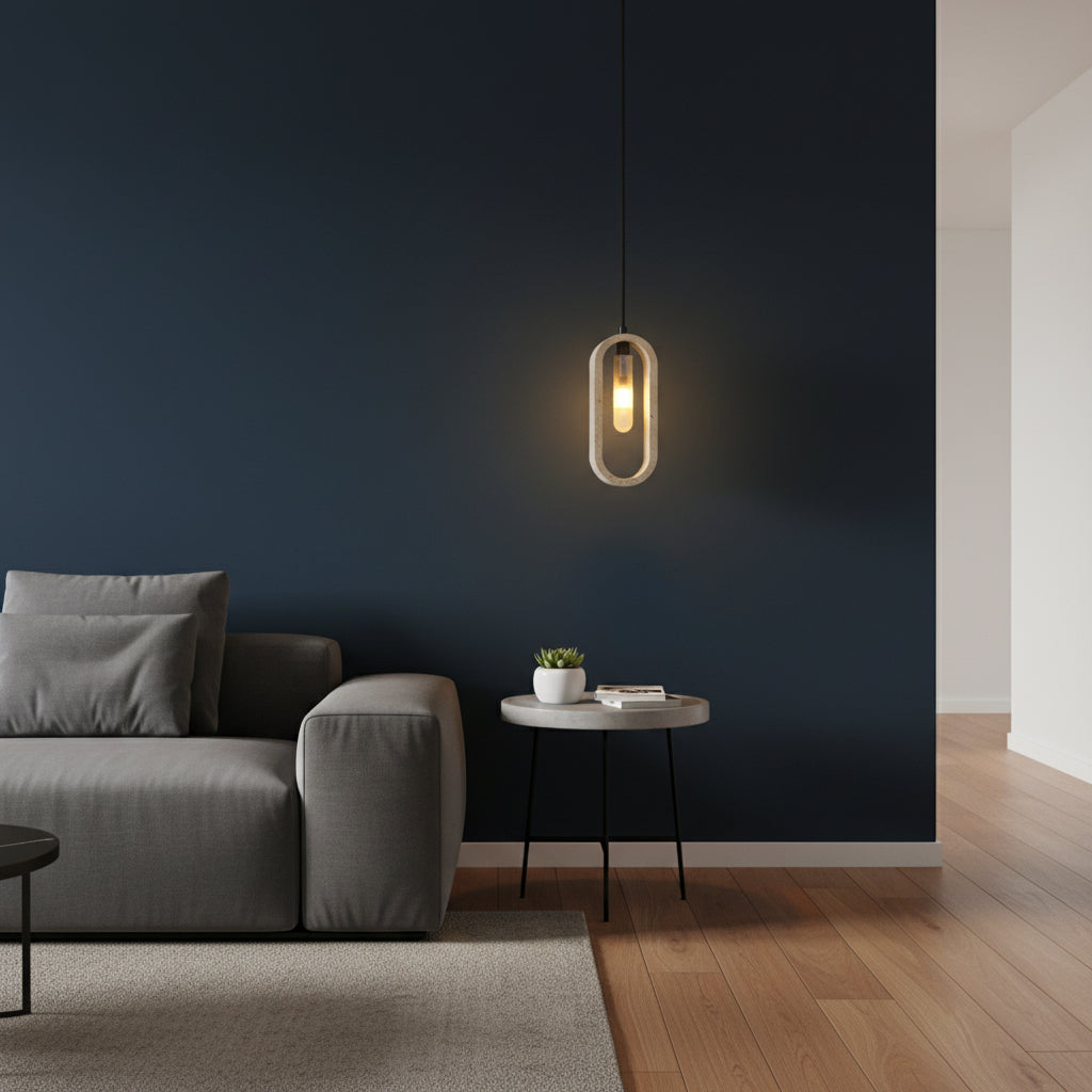 Oval travertine pendant light with warm glowing bulb, suspended from a black cord