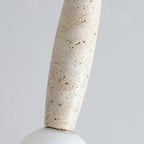 Travertine pendant shade in speckled stone cylinder shape