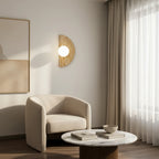 Half-moon travertine wall sconce with lit round white diffuser