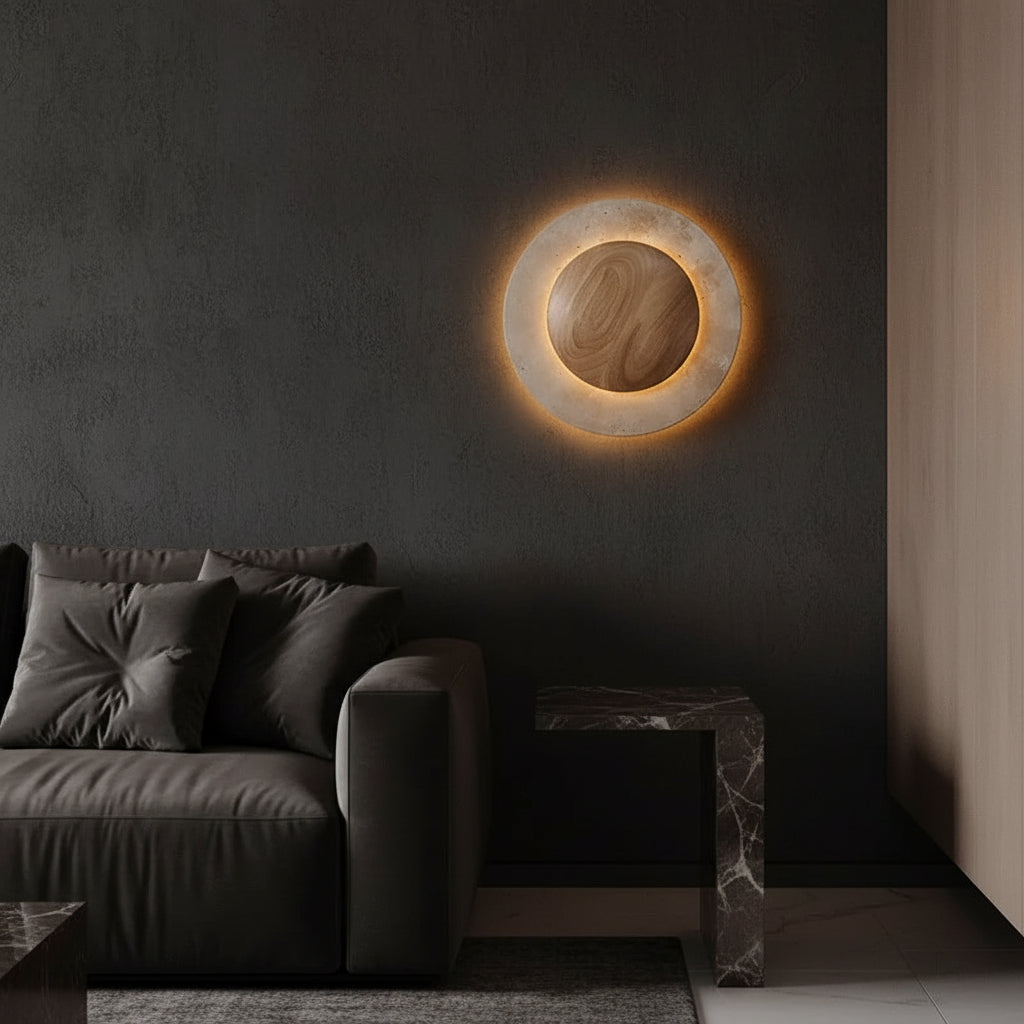 Round backlit wall sconce showing glowing inner ring and wood-tone center