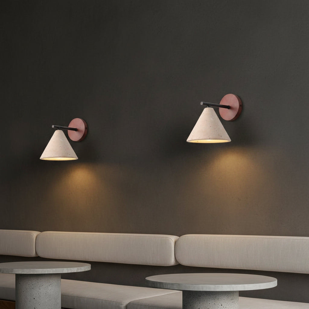 Pair of conical wall lights with round wood mounts, black arms, illuminated speckled shades
