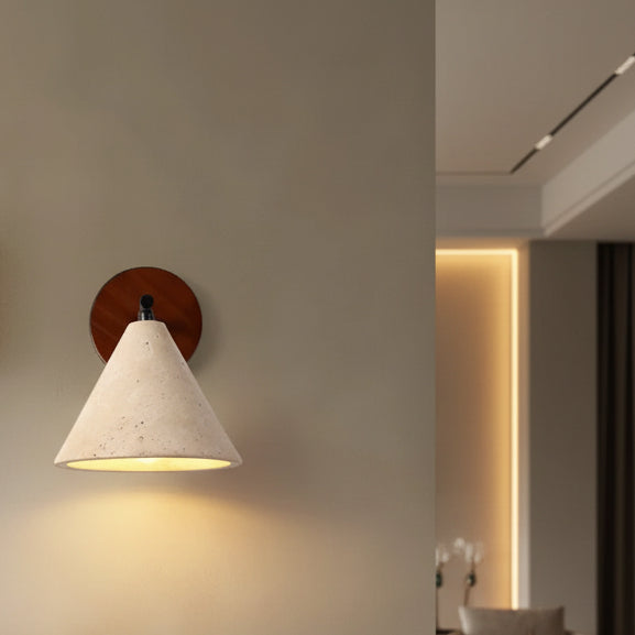 Conical wall sconce with round wood backplate and black arm, lit speckled shade
