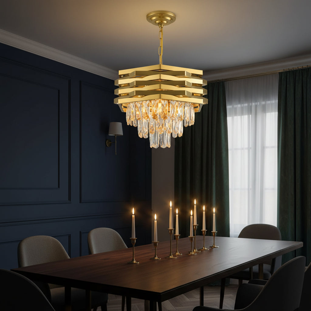 Gold stacked crystal chandelier above dining table with faceted hanging drops