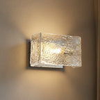 Rylen rectangular ripple glass wall sconce with warm glow and metal backplate