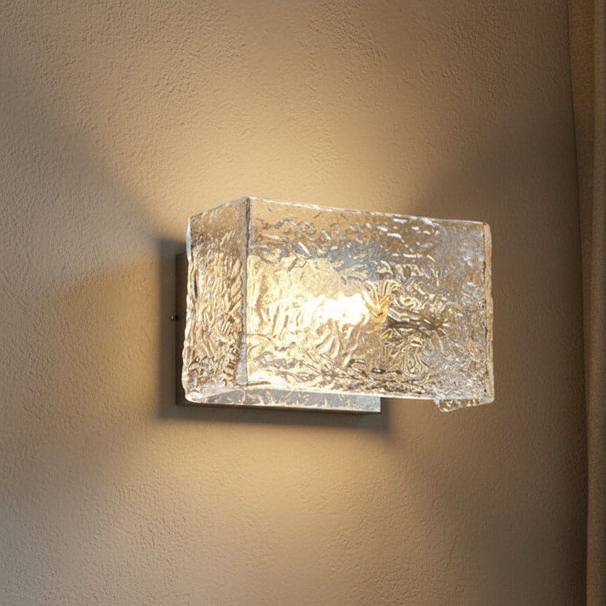 Rylen rectangular ripple glass wall sconce with warm glow and metal backplate