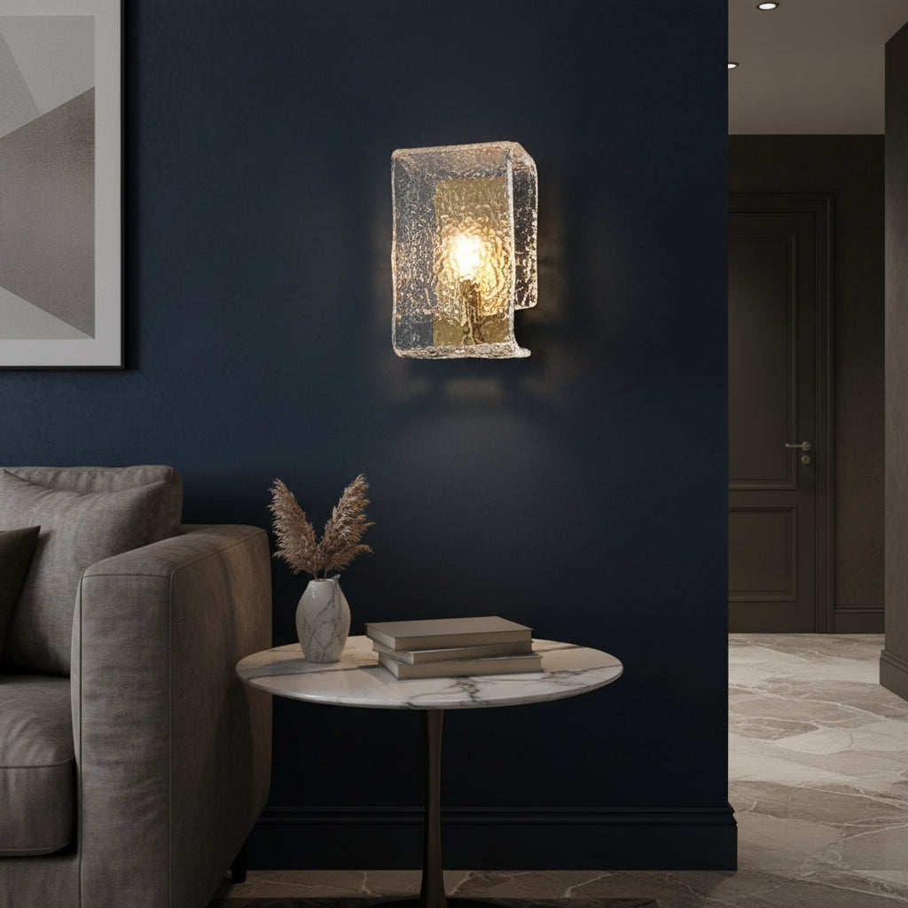 Rectangular ripple glass wall light with warm bulb glow and textured gold-and-silver finish