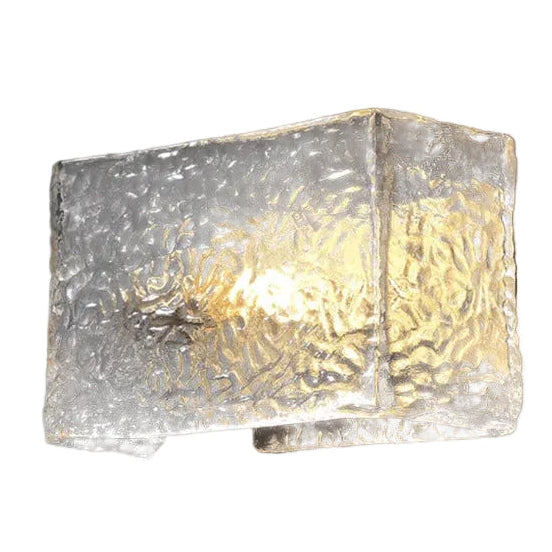 Rectangular textured glass wall sconce with gold-toned ripple pattern and metal mount