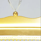 Gold top finial with clear crystal prisms on a chandelier shade