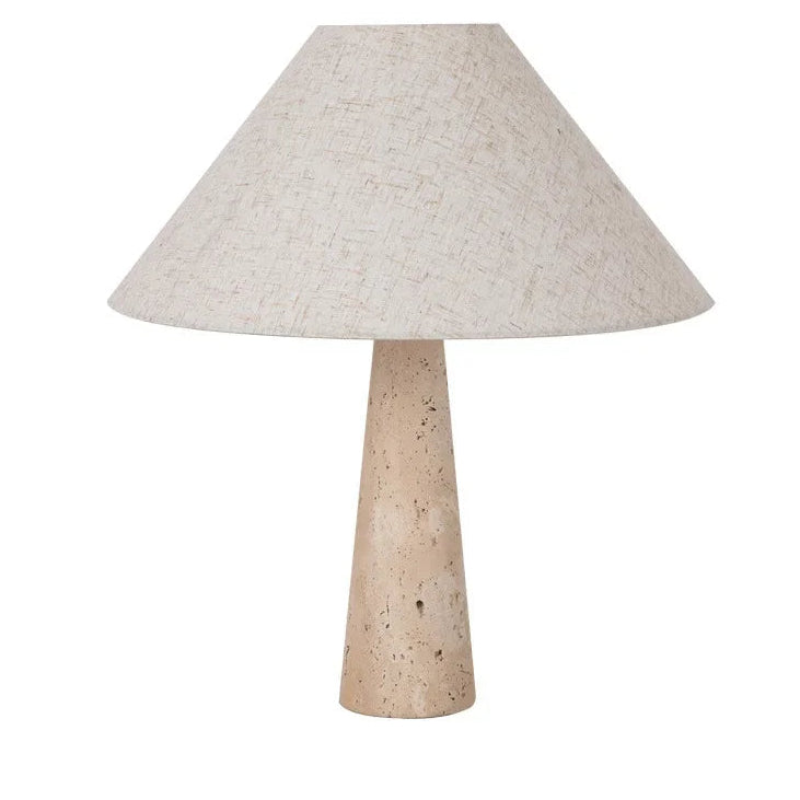 Conical fabric table lamp shade with speckled travertine pedestal base, light beige