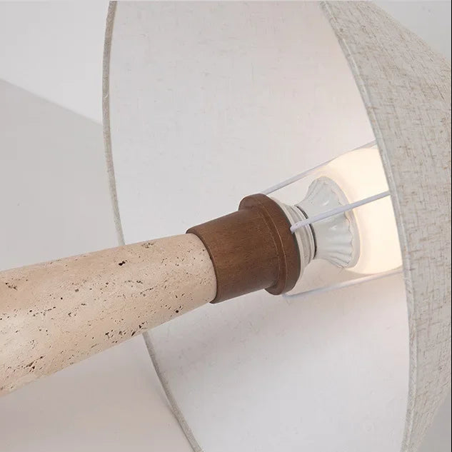 Travertine base with socket and inner diffuser under a conical fabric lamp shade