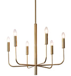 Gold candle-style chandelier with curved tubular arms and lit candle bulbs
