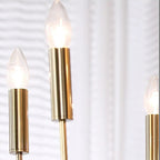 Close-up of gold candle bulbs with tubular metal holders