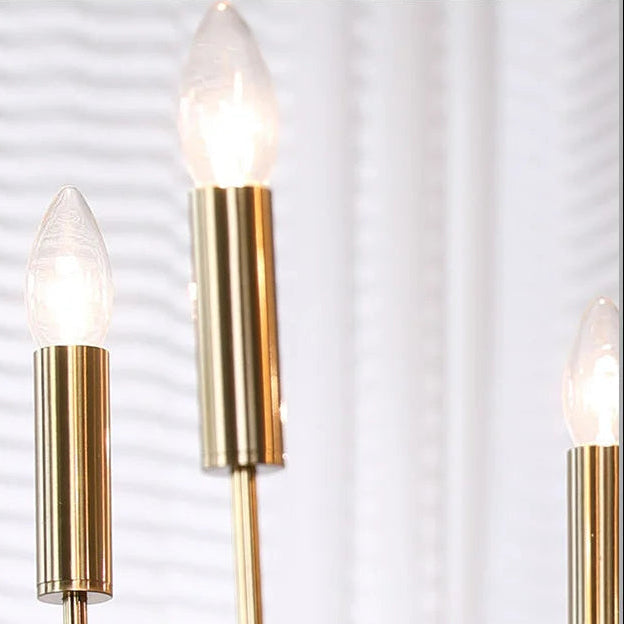 Close-up of gold candle bulbs with tubular metal holders