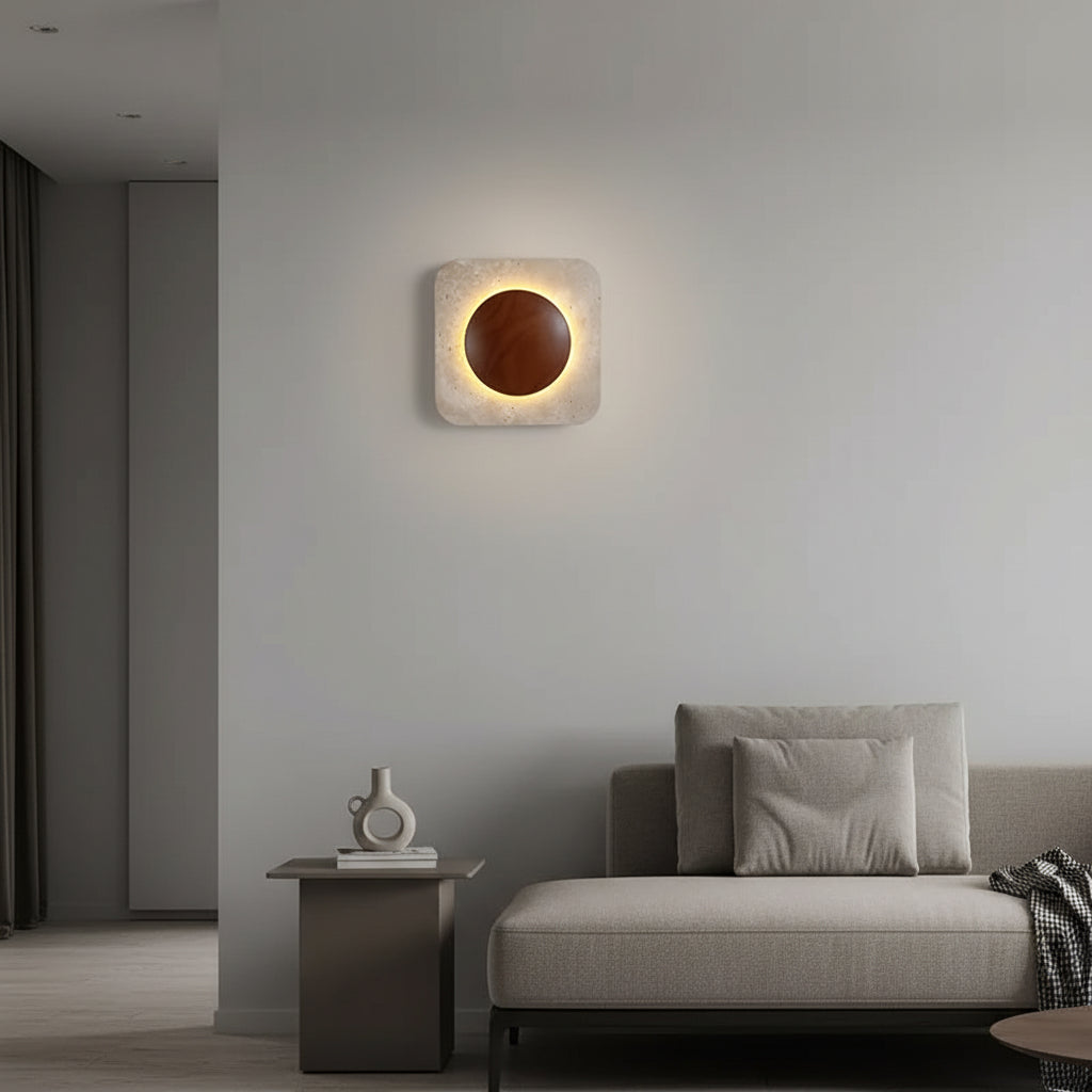 Square travertine backlit wall sconce with glowing circular center, warm light