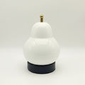 White gourd-shaped portable table lamp with gold top and black base.