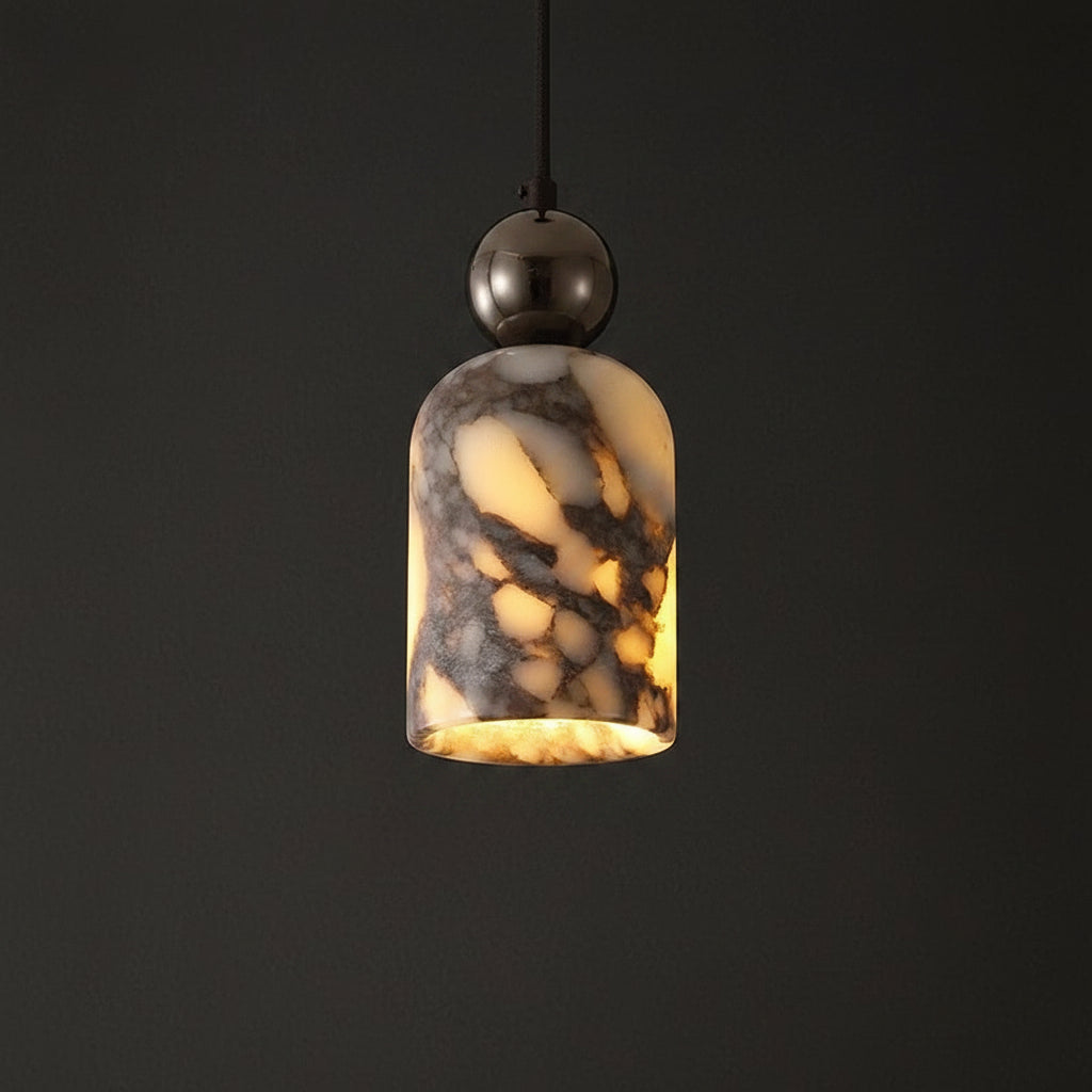 Marbled glass pendant shade with warm yellow glow, dark metal top, suspended on cord.
