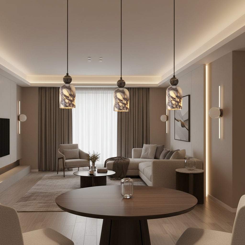 Cluster of marbled glass pendant lights with warm yellow glow, dark metal tops.