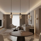 Cluster of marbled glass pendant lights with warm yellow glow, dark metal tops.
