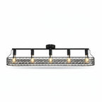 Black cage flush mount ceiling light with exposed amber bulbs and metal scroll pattern