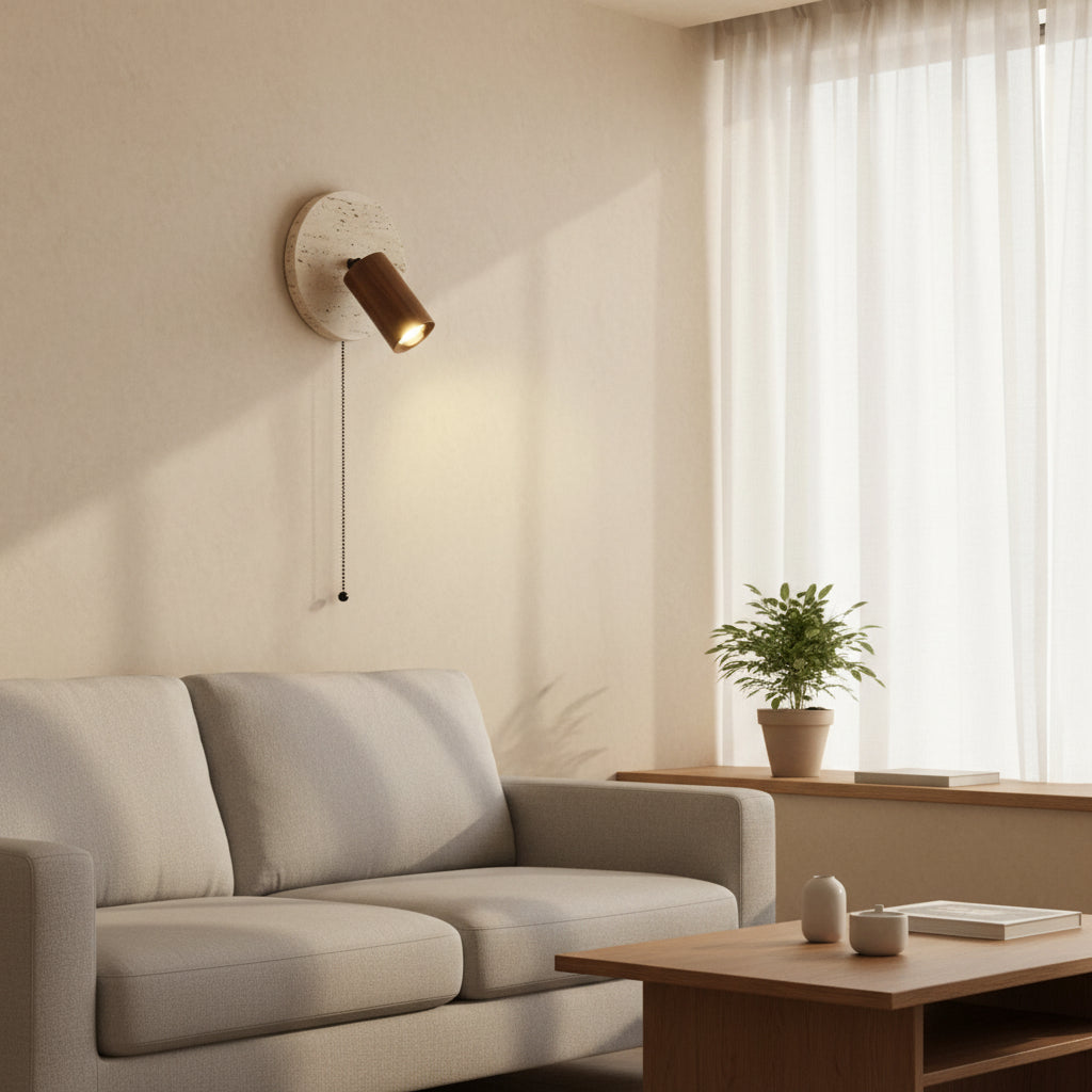 Wall spotlight sconce with round travertine disc and walnut cylinder shade, hanging pull cord