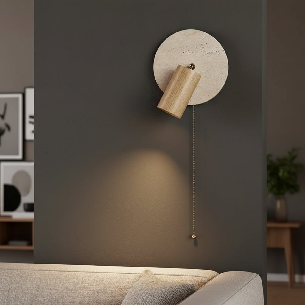 Wall spotlight sconce with round travertine disc, light wood cylinder shade, pull cord