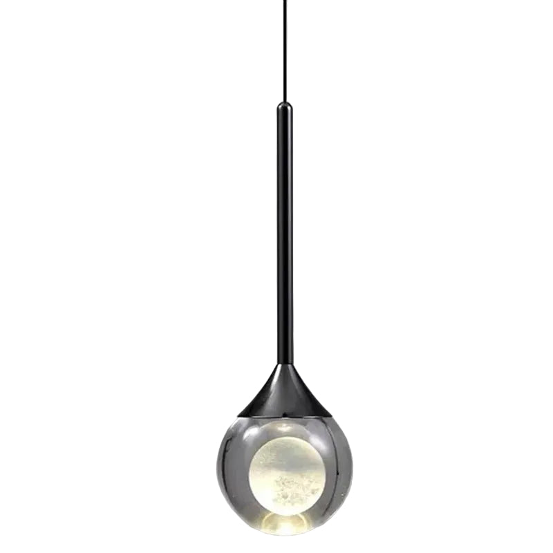 Teardrop pendant light with black stem and clear smoked glass shade with warm inner globe