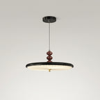 Black UFO-style pleated pendant light with round ribbed shade