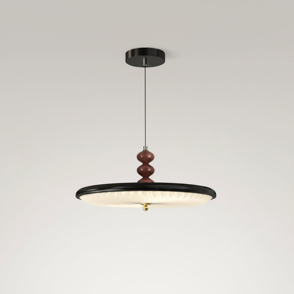 Black UFO-style pleated pendant light with round ribbed shade