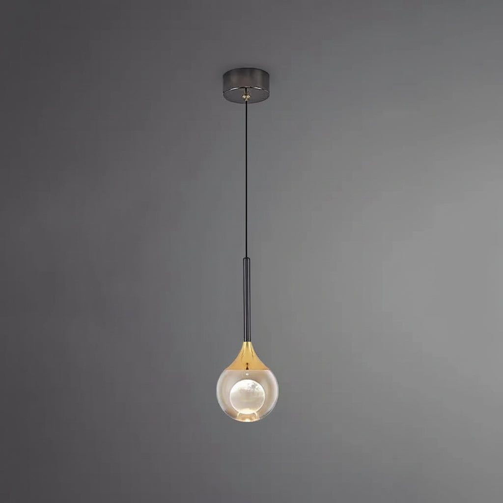 Teardrop pendant light with dark metal ceiling mount and warm glowing glass globe shade